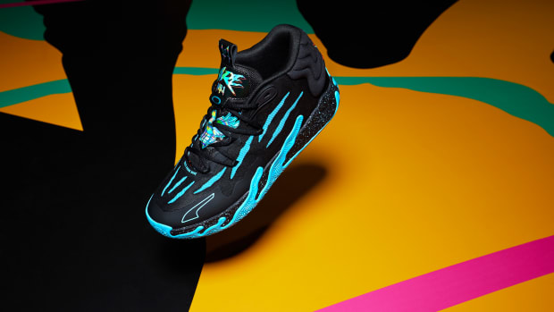 Side view of LaMelo Ball's black and blue PUMA sneakers.